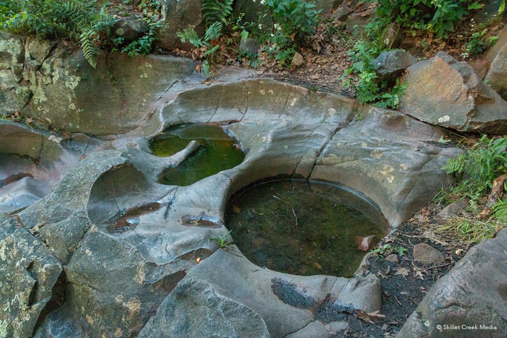 Potholes in stone on the Potholes Trail