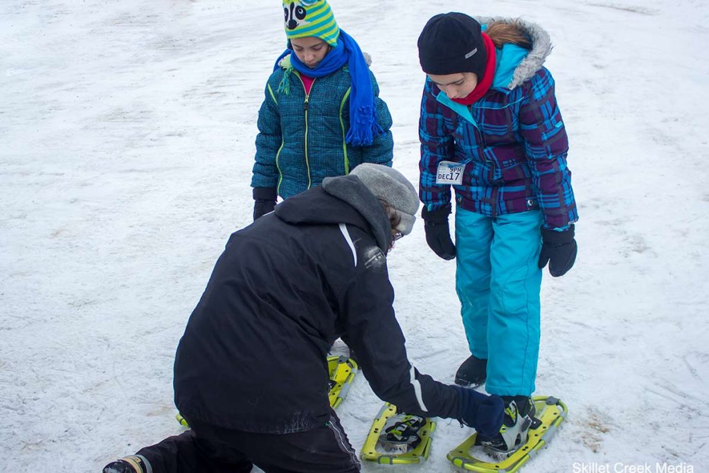 Putting on Snowshoes