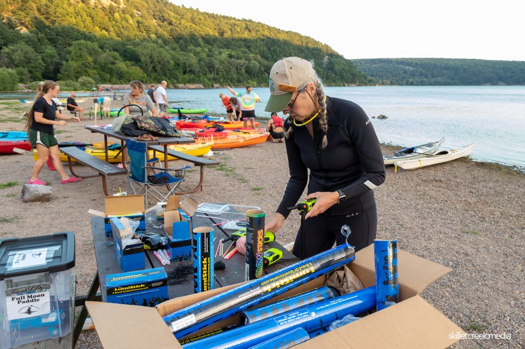 Naturalist preparing radios for the safety boaters.