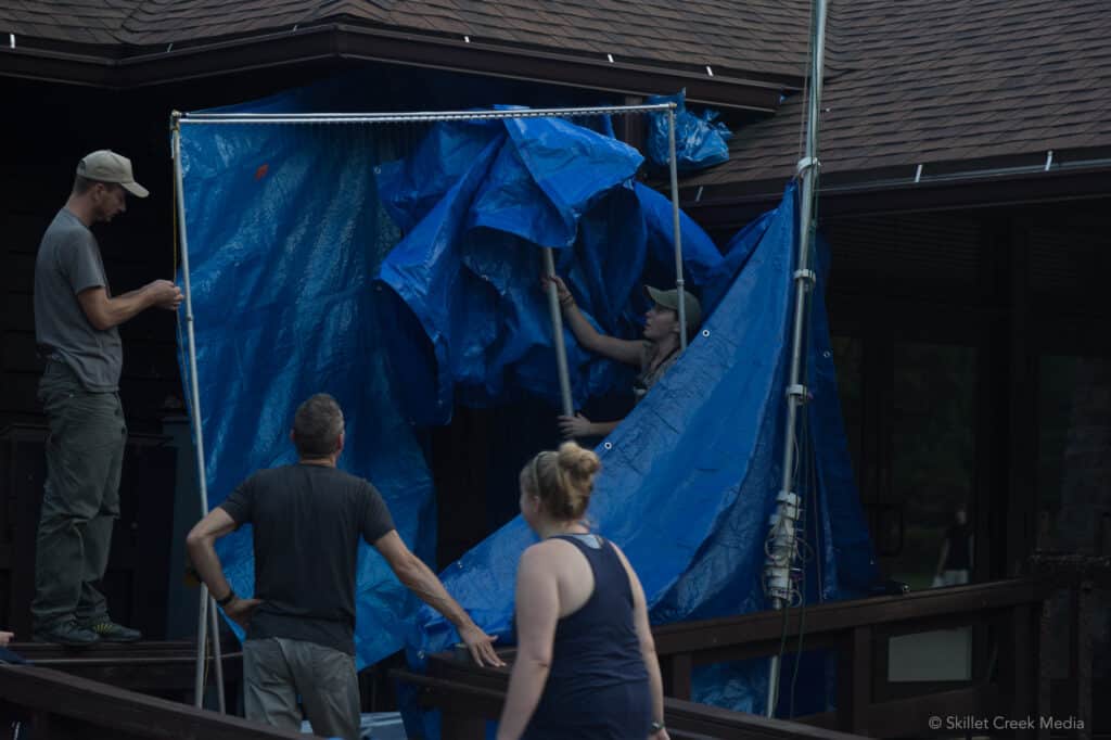 Preparing a tarp to catch bats for a survey in 2015.