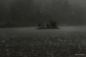 Under the storm as it crosses the lake. Large Hail hits the water